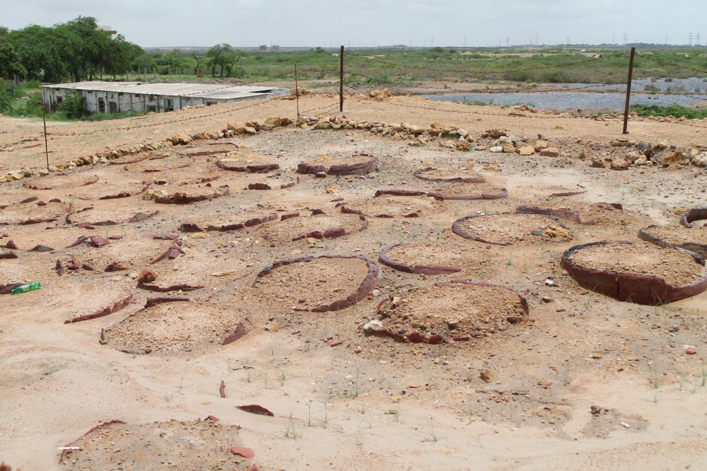 Archaeological remains of the wells where dhobis washed clothes in Bhambhore